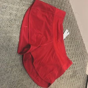 Red Lululemon speed up shorts. Size 2.